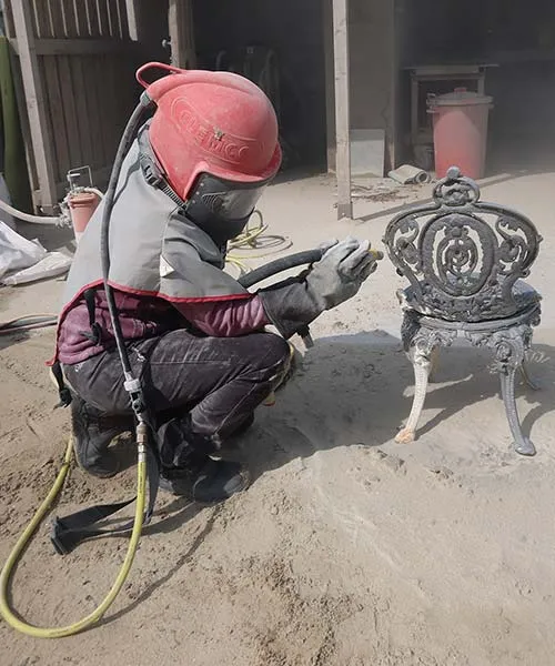 Garden Chair Being Sandblasted